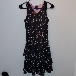 Sleeveless polka dot chiffon layered dress.